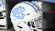 Dec 27, 2023; Charlotte, NC, USA; North Carolina Tar Heels white helmet during pregame warm ups against the West Virginia Mountaineers at Bank of America Stadium. 