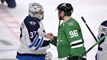 May 17, 2025; Dallas, Texas, USA; Winnipeg Jets goaltender Connor Hellebuyck (37) shakes hands with Dallas Stars right wing Mikko Rantanen (96) after the Stars defeat the Jets in the overtime period in game six of the second round of the 2025 Stanley Cup Playoffs at American Airlines Center. Mandatory Credit: Jerome Miron-Imagn Images
