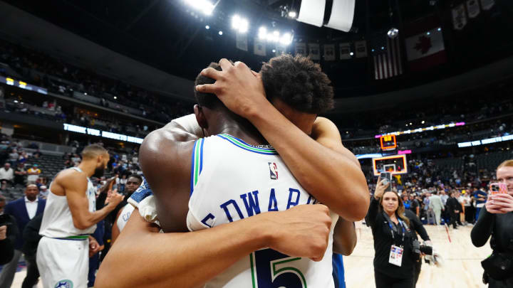 May 19, 2024; Denver, Colorado, USA; Minnesota Timberwolves center Karl-Anthony Towns (32) and guard Anthony Edwards (5) celebrate defeating the Denver Nuggets in game seven of the second round for the 2024 NBA playoffs at Ball Arena. Mandatory Credit: Ron Chenoy-USA TODAY Sports