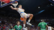 Nov 11, 2025; Lawrence, Kansas, USA; Kansas Jayhawks guard Kohl Rosario (7) dunks the ball during the first half against the Texas A&M-Corpus Christi Islanders at Allen Fieldhouse. Mandatory Credit: Jay Biggerstaff-Imagn Images