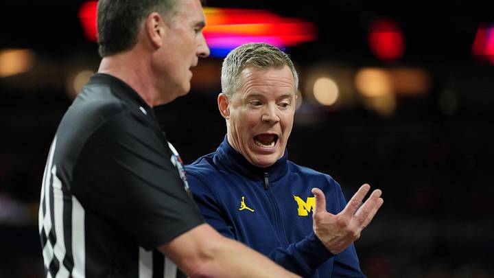 Apr 4, 2026; Indianapolis, IN, USA; Michigan Wolverines head coach Dusty May talks with an official during the first half in a semifinal of the Final Four of the men's 2026 NCAA Tournament at Lucas Oil Stadium. Mandatory Credit: Bob Donnan-Imagn Images