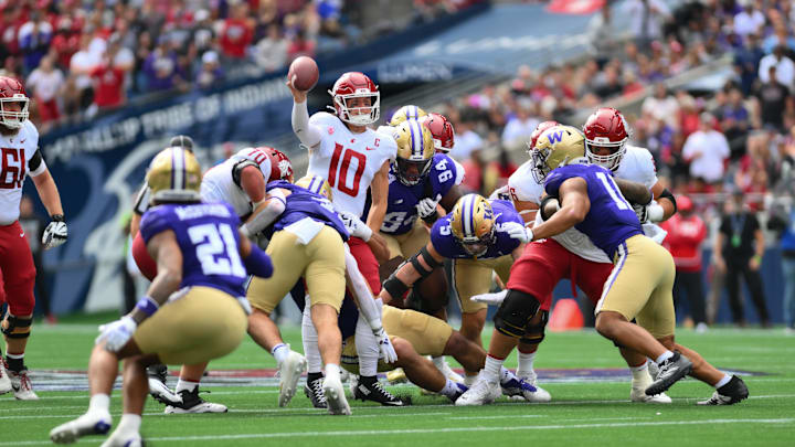 Sep 14, 2024; Seattle, Washington, USA; Washington State Cougars quarterback John Mateer (10) passes the ball against the Washington Huskies during the first half at Lumen Field. Mandatory Credit: Steven Bisig-Imagn Images