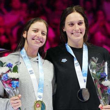 Kate Douglass and Alex Walsh pose for a photo during the medal ceremony for the 200-meter individual medley final, Saturday, June 22, 2024, during the eighth day of the U.S. Olympic Team Swimming Trials at Lucas Oil Stadium in Indianapolis.