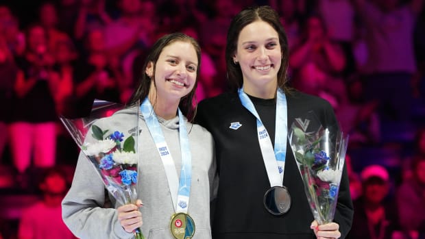 Kate Douglass and Alex Walsh pose for a photo during the medal ceremony for the 200-meter individual medley at Olympic Trials