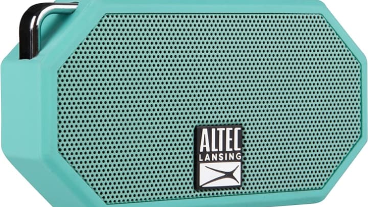 Altec Lansing Mini wireless Bluetooth speaker in teal against white background.