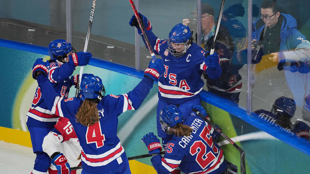 Feb 5, 2026; Milan, Italy; Hilary Knight (21) of Team United States celebrates with Alex Carpenter (25) after scoring a goal against Team Czechia in women's ice hockey Group A play during the Milano Cortina 2026 Olympic Winter Games at Milano Rho Ice Hockey Arena. 