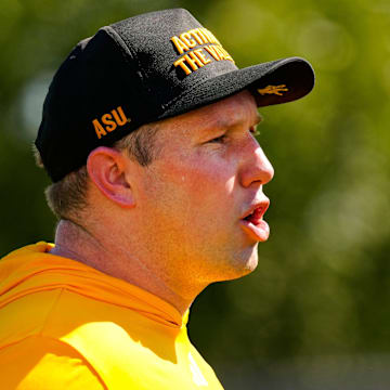 Arizona State head coach Kenny Dillingham yells to his defensive linemen as they run a drill during the first day of fall practice in Tempe, Ariz. on July 30, 2025.