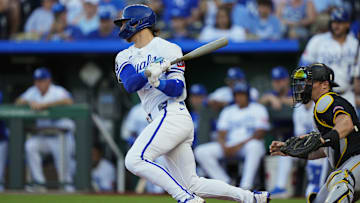 Kansas City Royals shortstop Bobby Witt Jr. hits a single during the first inning against the Pittsburgh Pirates at Kauffman Stadium.