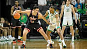 Indiana Hoosiers guard Trey Galloway (32) dribbles the ball against Oregon Ducks guard Keeshawn Barthelemy (9) during the first half at Matthew Knight Arena.