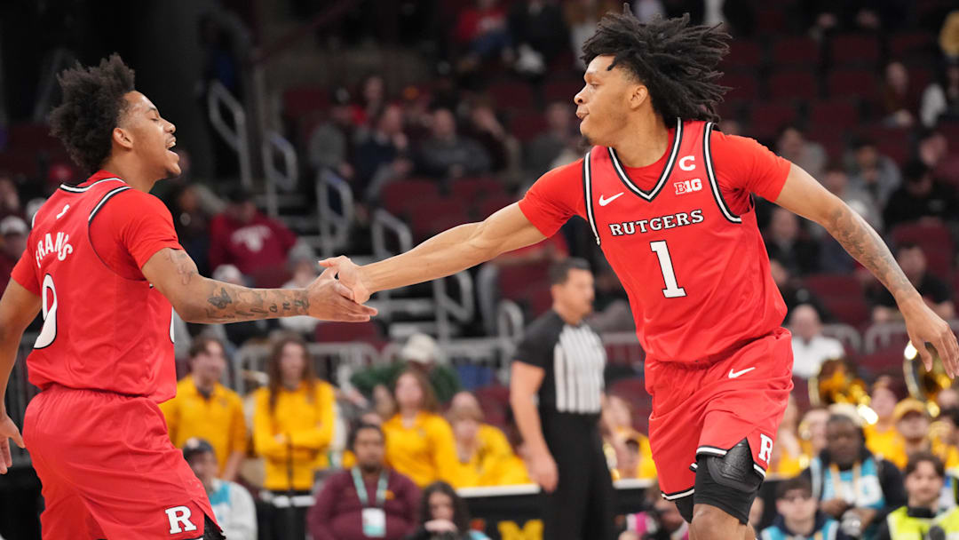 Mar 11, 2026; Chicago, IL, USA; Rutgers Scarlet Knights guard Jamichael Davis (1) is greeted by Rutgers Scarlet Knights guard Tariq Francis (0) after making a three point basket against the Minnesota Golden Gophers during the first half at United Center. Mandatory Credit: David Banks-Imagn Images