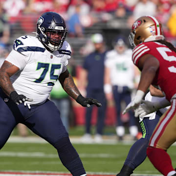 Dec 10, 2023; Santa Clara, California, USA; Seattle Seahawks guard Anthony Bradford (75) blocks against San Francisco 49ers linebacker Fred Warner (right) during the first quarter at Levi's Stadium. Mandatory Credit: Darren Yamashita-Imagn Images