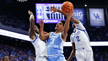 Dec 2, 2025; Lexington, Kentucky, USA; North Carolina Tar Heels guard Derek Dixon (3) goes to the basket against Kentucky Wildcats forward Brandon Garrison (10) and guard Jasper Johnson (2) during the first half at Rupp Arena at Central Bank Center. Mandatory Credit: Jordan Prather-Imagn Images