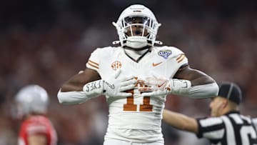 Jan 10, 2025; Arlington, Texas, USA; Texas Longhorns linebacker Colin Simmons (11) celebrates after a pass break up during the third quarter of the College Football Playoff semifinal against the Ohio State Buckeyes in the Cotton Bowl at AT&T Stadium. Mandatory Credit: Tim Heitman-Imagn Images