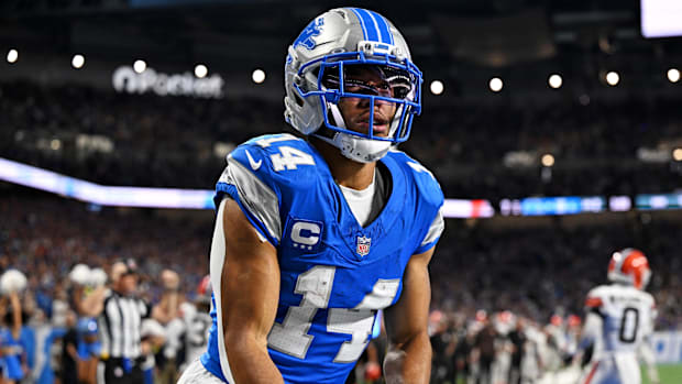 Detroit Lions wide receiver Amon-Ra St. Brown (14) celebrates after catching a touchdown pass  