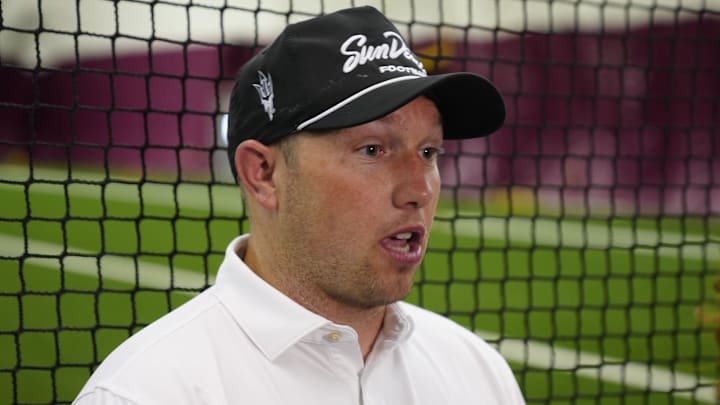 ASU head coach Kenny Dillingham talks with the press during an ASU annual kids football camp inside the Verde Dickey Dome in Tempe, Ariz. on June 11, 2025.
