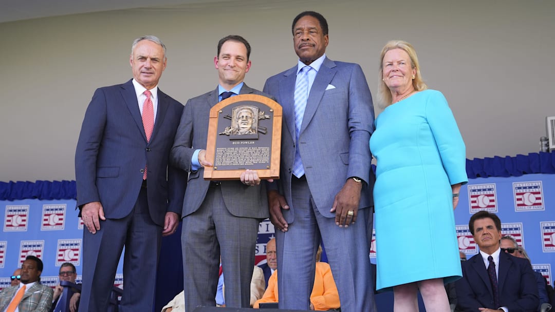 Jul 24, 2022; Cooperstown, New York, USA; MLB commissioner Rob Manfred (left) and Hall of Fame president Josh Rawitch (center) and national baseball hall of fame chairman of the board Jane Forbes Clark (right) present Hall of Famer Dave Winfield with the plague for Bud Fowler 