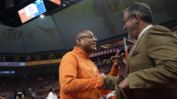 Texas Longhorns assistant head coach Rodney Terry, former UTEP Miner head coach, speaks with University of Texas Athletic Director Chris Del Conte.