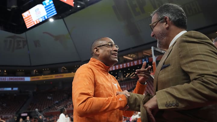 Texas Longhorns assistant head coach Rodney Terry, former UTEP Miner head coach, speaks with University of Texas Athletic Director Chris Del Conte.