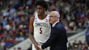 Mar 21, 2025; Raleigh, NC, USA;  Connecticut Huskies head coach Dan Hurley with center Tarris Reed Jr. (5) during the second half against the Oklahoma Sooners at Lenovo Center. Mandatory Credit: Bob Donnan-Imagn Images