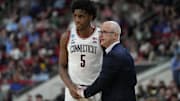 Mar 21, 2025; Raleigh, NC, USA;  Connecticut Huskies head coach Dan Hurley with center Tarris Reed Jr. (5) during the second half against the Oklahoma Sooners at Lenovo Center. Mandatory Credit: Bob Donnan-Imagn Images