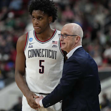 Mar 21, 2025; Raleigh, NC, USA;  Connecticut Huskies head coach Dan Hurley with center Tarris Reed Jr. (5) during the second half against the Oklahoma Sooners at Lenovo Center. Mandatory Credit: Bob Donnan-Imagn Images