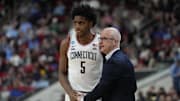 Mar 21, 2025; Raleigh, NC, USA;  Connecticut Huskies head coach Dan Hurley with center Tarris Reed Jr. (5) during the second half against the Oklahoma Sooners at Lenovo Center. Mandatory Credit: Bob Donnan-Imagn Images