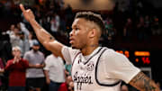 Feb 15, 2023; College Station, Texas, USA; Texas A&M Aggies guard Dexter Dennis (0) gives a thumbs up to the crowd as he exits the court after the win against the Arkansas Razorbacks at Reed Arena. Mandatory Credit: Maria Lysaker-Imagn Images