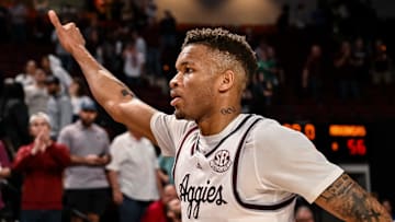 Feb 15, 2023; College Station, Texas, USA; Texas A&M Aggies guard Dexter Dennis (0) gives a thumbs up to the crowd as he exits the court after the win against the Arkansas Razorbacks at Reed Arena. Mandatory Credit: Maria Lysaker-Imagn Images