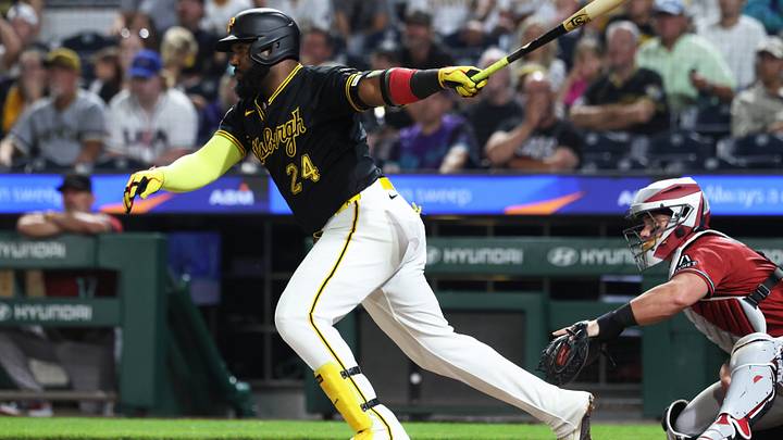 Jul 28, 2026; Pittsburgh, Pennsylvania, USA;  Pittsburgh Pirates designated hitter Marcell Ozuna (24) hits an RBI single against the Arizona Diamondbacks during the eighth inning at PNC Park. Mandatory Credit: Charles LeClaire-Imagn Images