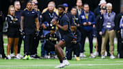 Colorado Buffaloes quarterback Shedeur Sanders looks to make a pass at the University of Colorado NFL Showcase at the CU Indoor Practice Facility. 