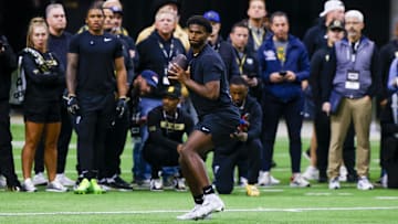 Colorado Buffaloes quarterback Shedeur Sanders looks to make a pass at the University of Colorado NFL Showcase at the CU Indoor Practice Facility. 