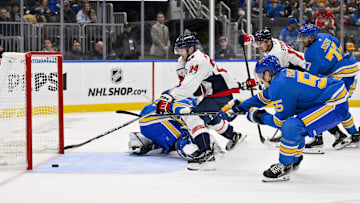 Nov 9, 2024; St. Louis, Missouri, USA;  Washington Capitals center Connor McMichael (24) shoots and scores against St. Louis Blues goaltender Jordan Binnington (50) during the third period at Enterprise Center. Mandatory Credit: Jeff Curry-Imagn Images