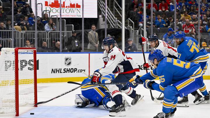 Nov 9, 2024; St. Louis, Missouri, USA;  Washington Capitals center Connor McMichael (24) shoots and scores against St. Louis Blues goaltender Jordan Binnington (50) during the third period at Enterprise Center. Mandatory Credit: Jeff Curry-Imagn Images