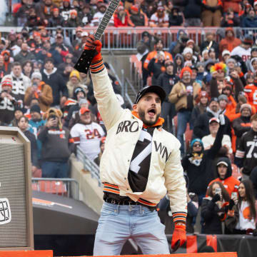 Dec 10, 2023; Cleveland, Ohio, USA; WWE wrestler Johnny Gargano holds up a broken guitar that he smashed before the game between the Cleveland Browns and the Jacksonville Jaguars at Cleveland Browns Stadium. Mandatory Credit: Ken Blaze-USA TODAY Sports
