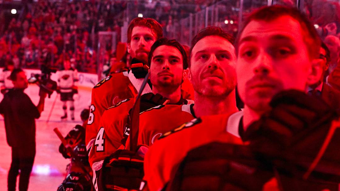 Chicago Blackhawks players look on during the national anthem before the game against the Minnesota Wild  at the United Center.  Mandatory Credit: Matt Marton-Imagn Images