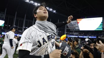 Mar 21, 2023; Miami, Florida, USA; Japan designated hitter Shohei Ohtani (16) puts on a champions