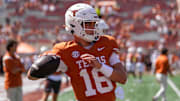 Texas Longhorns quarterback Arch Manning warms up before the game against the Mississippi State Bulldogs 