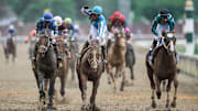 Jockey Javier Castellano raises his fist in celebration after he and Mage won the 149th Kentucky Derby at Churchill Downs in 2023.