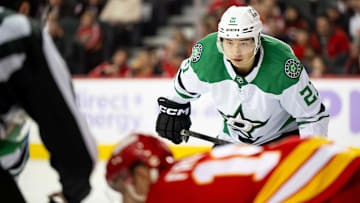 Nov 22, 2025; Calgary, Alberta, CAN; Dallas Stars left wing Jason Robertson (21) gets ready for a face-off against the Calgary Flames during the second period at Scotiabank Saddledome. Mandatory Credit: Brett Holmes-Imagn Images