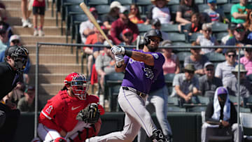 Mar 10, 2025; Tempe, Arizona, USA; Colorado Rockies Nick Martini hits against the Los Angeles Angels in the first inning at Tempe Diablo Stadium. Mandatory Credit: Rick Scuteri-Imagn Images