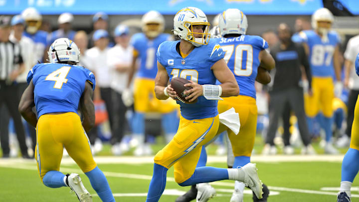 Sep 8, 2024; Inglewood, California, USA; Los Angeles Chargers quarterback Justin Herbert (10) looks to pass in the first half against the Las Vegas Raiders at SoFi Stadium. Mandatory Credit: Jayne Kamin-Oncea-Imagn Images