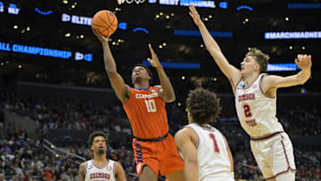 Mar 30, 2024; Los Angeles, CA, USA; Clemson Tigers forward RJ Godfrey (10) shoots against Alabama Crimson Tide forward Grant Nelson (2) in the first half in the finals of the West Regional of the 2024 NCAA Tournament at Crypto.com Arena. Mandatory Credit: Jayne Kamin-Oncea-Imagn Images