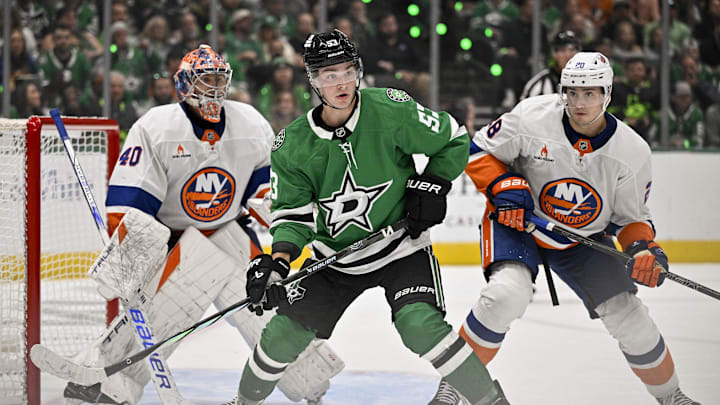 Oct 12, 2024; Dallas, Texas, USA; New York Islanders goaltender Semyon Varlamov (40) and defenseman Alexander Romanov (28) and Dallas Stars center Wyatt Johnston (53) in action during the game between the Dallas Stars and the New York Islanders at the American Airlines Center. Mandatory Credit: Jerome Miron-Imagn Images