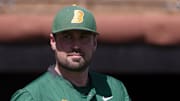 North Dakota State's head baseball coach Tyler Oakes walks to the pitcher's mound against Texas Tech in a non conference baseball game, Saturday, April 8, 2023, at Dan Law Field at Rip Griffin Park.