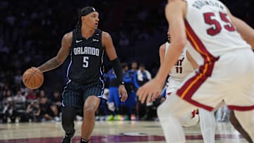 Oct 23, 2024; Miami, Florida, USA;  Orlando Magic forward Paolo Banchero (5) sets up the offense against the Miami Heat during the second half at Kaseya Center. Mandatory Credit: Jim Rassol-Imagn Images