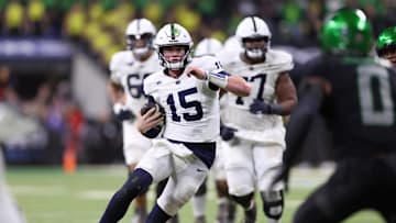 Dec 7, 2024; Indianapolis, IN, USA; Penn State Nittany Lions quarterback Drew Allar (15) runs for a gain against the Oregon Ducks during the fourth quarter in the 2024 Big Ten Championship game at Lucas Oil Stadium. Mandatory Credit: Jordan Prather-Imagn Images