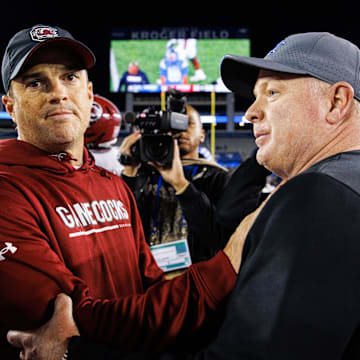 Oct 8, 2022; Lexington, Kentucky, USA; South Carolina Gamecocks head coach Shane Beamer and Kentucky Wildcats head coach Mark Stoops shake hands after a game at Kroger Field. Mandatory Credit: Jordan Prather-Imagn Images