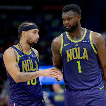 Jan 7, 2025; New Orleans, Louisiana, USA; New Orleans Pelicans guard Jose Alvarado (15), forward Zion Williamson (1), and forward Herbert Jones (2) react during the second half against the Minnesota Timberwolves at Smoothie King Center. Mandatory Credit: Matthew Hinton-Imagn Images