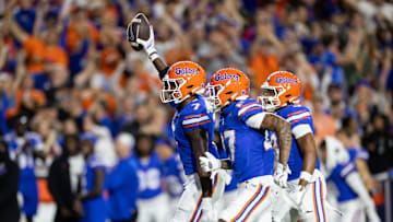 Oct 19, 2024; Gainesville, Florida, USA; Florida Gators defensive back Trikweze Bridges (7) and Florida Gators defensive back Dijon Johnson (27) celebrate an interception against the Kentucky Wildcats during the first half at Ben Hill Griffin Stadium. Mandatory Credit: Matt Pendleton-Imagn Images