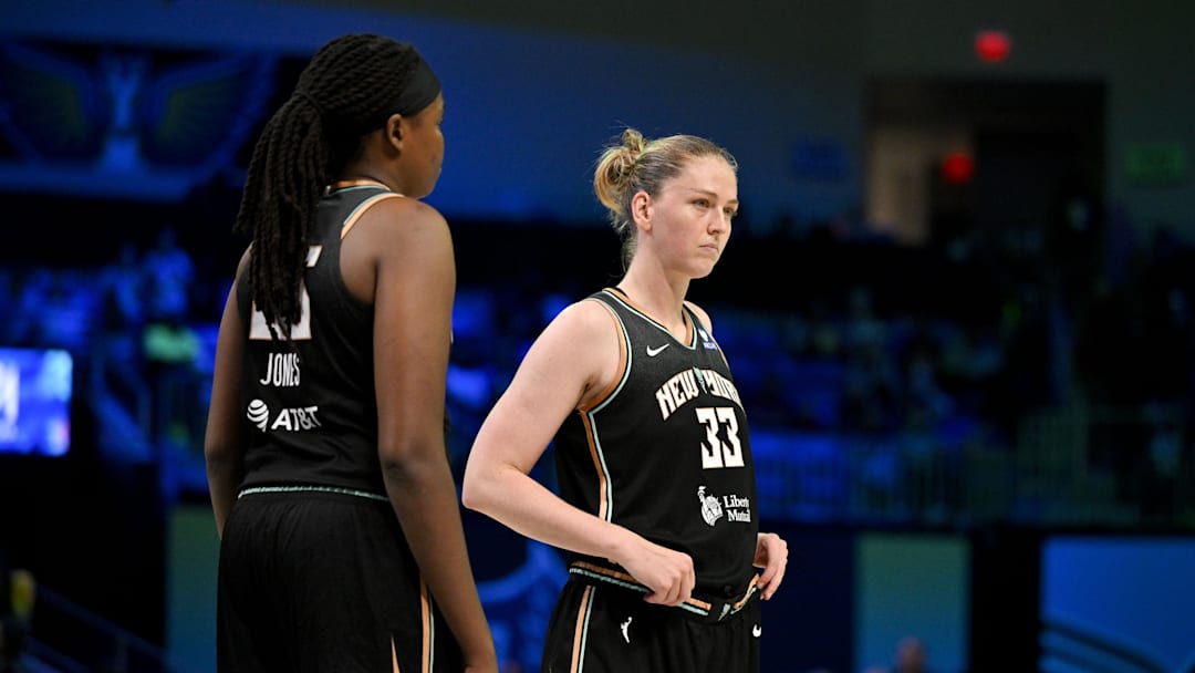 Aug 8, 2025; Arlington, Texas, USA; New York Liberty center Jonquel Jones (35) and center Emma Meesseman (33) in action during the game between the Dallas Wings and the New York Liberty at College Park Center. Mandatory Credit: Jerome Miron-Imagn Images